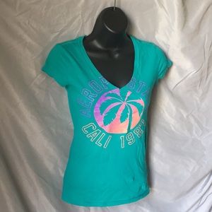 Purple to orange Sunset graphic sparkle teal shirt